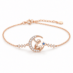 Bracelet Isabeau or rosé Petit Prince et étoile bleue, posé de face sur fond blanc