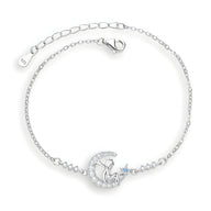 Bracelet en argent sterling avec pendentif lune et Petit Prince, détail étoile bleue, chaîne fine.