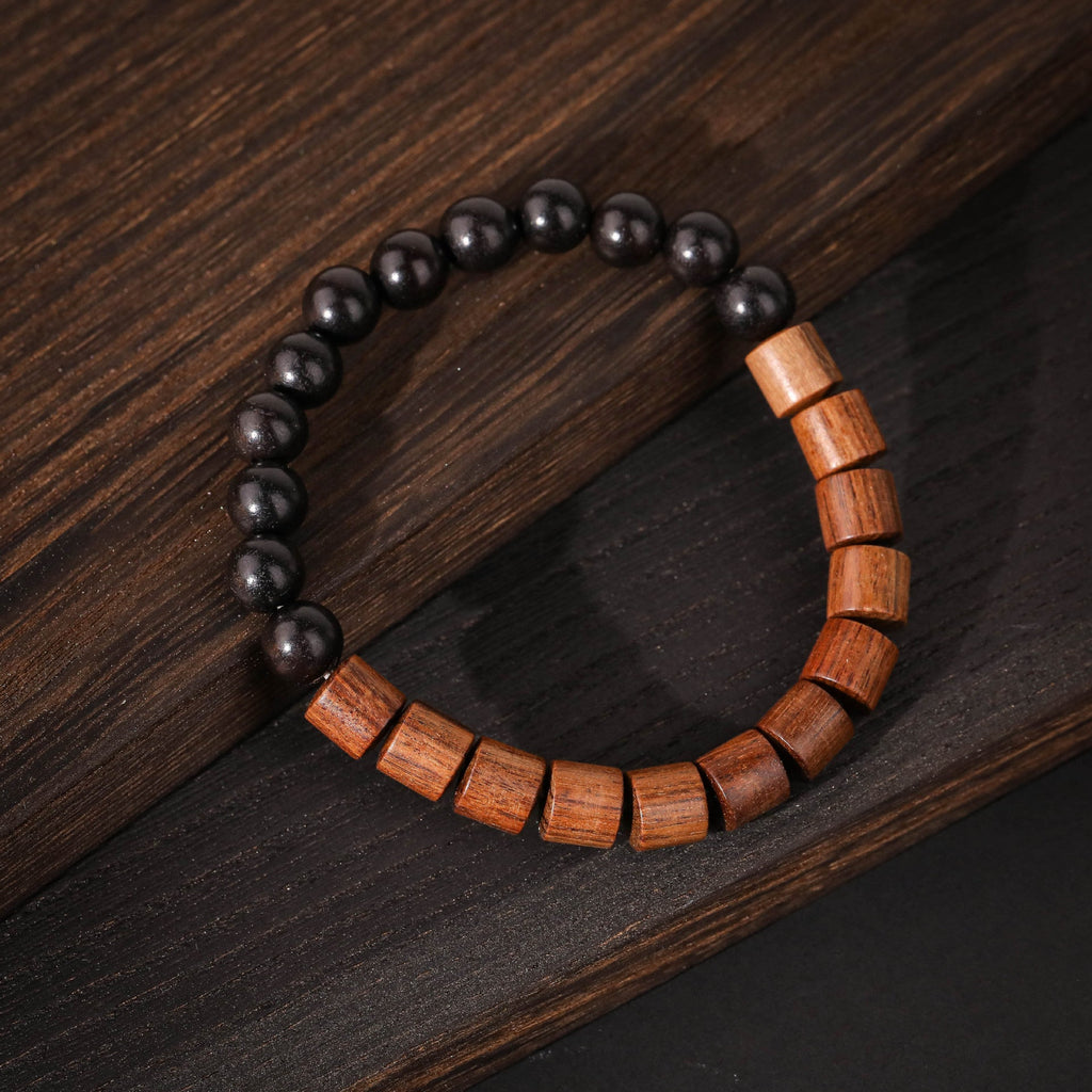 Bracelet en perles rondes noires et barres en bois de palissandre marron, style Marwa.