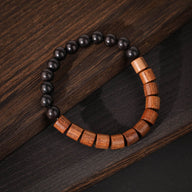 Bracelet en perles rondes noires et barres en bois de palissandre marron, style Marwa.