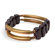 Bracelet flexible en bois d'ébène noir et tubes de cuivre brossé pour femme.