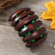 Bracelet femme en bois café avec perles vertes, design audacieux à segments incurvés.
