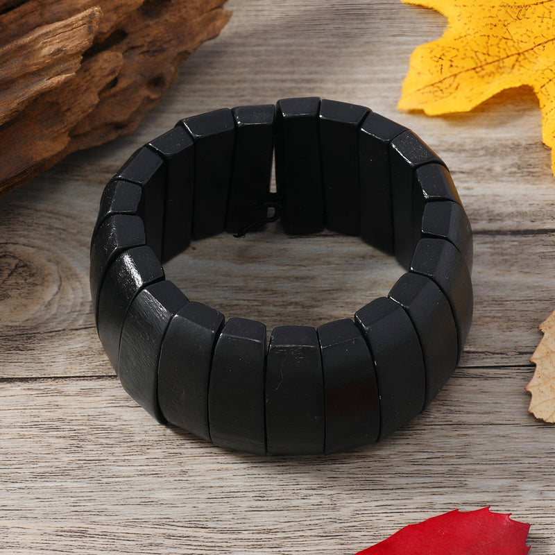 Bracelet femme en bois naturel noir, composé de plaques rectangulaires lisses et brillantes.