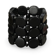 Bracelet femme en bois naturel noir avec larges perles rondes et monture élastique.