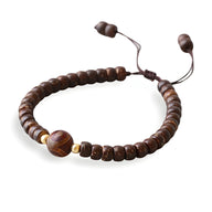 Bracelet mixte en coquilles de noix de coco marron avec pierre d'agate ronde et perles dorées ajustable.