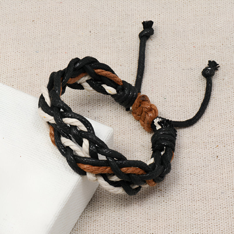 Bracelet femme en corde tressée multicolore noir, blanc et marron, fermoir coulissant en nœud.