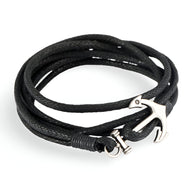 Bracelet en corde noire avec fermoir ancre argentée, style marin et élégant pour femme.