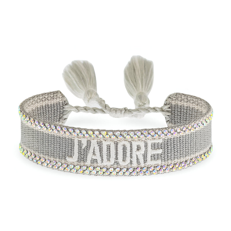 Bracelet en corde tressée gris avec inscription "J'ADORE" en blanc et bordure multicolore scintillante.