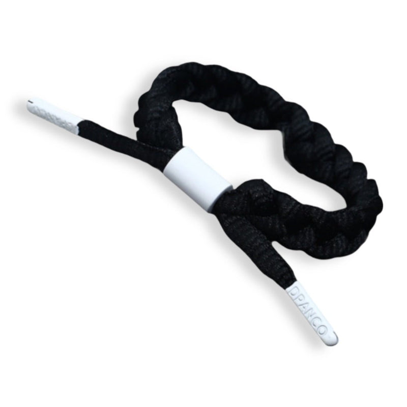 Bracelet en corde tressée noir avec embouts blancs et fermeture métallique argentée.