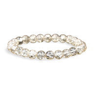 Bracelet femme en perles de cristal transparentes rondes et facettées.