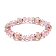Bracelet femme en cristal rose clair avec perles facettées et anneaux argentés élégants.