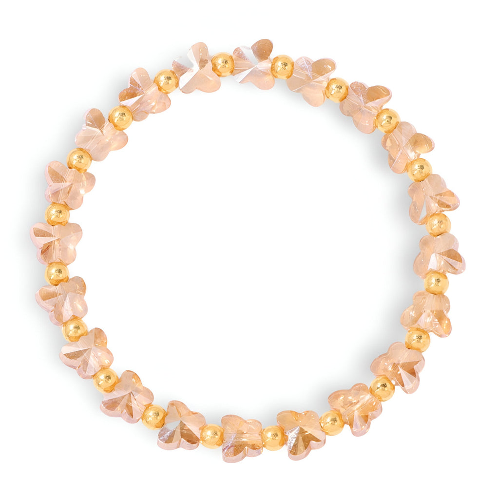 Bracelet femme en cristal rose clair avec petites perles dorées et formes irrégulières style papillon.