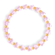 Bracelet élastique rose avec papillons en cristal et perles dorées brillantes.