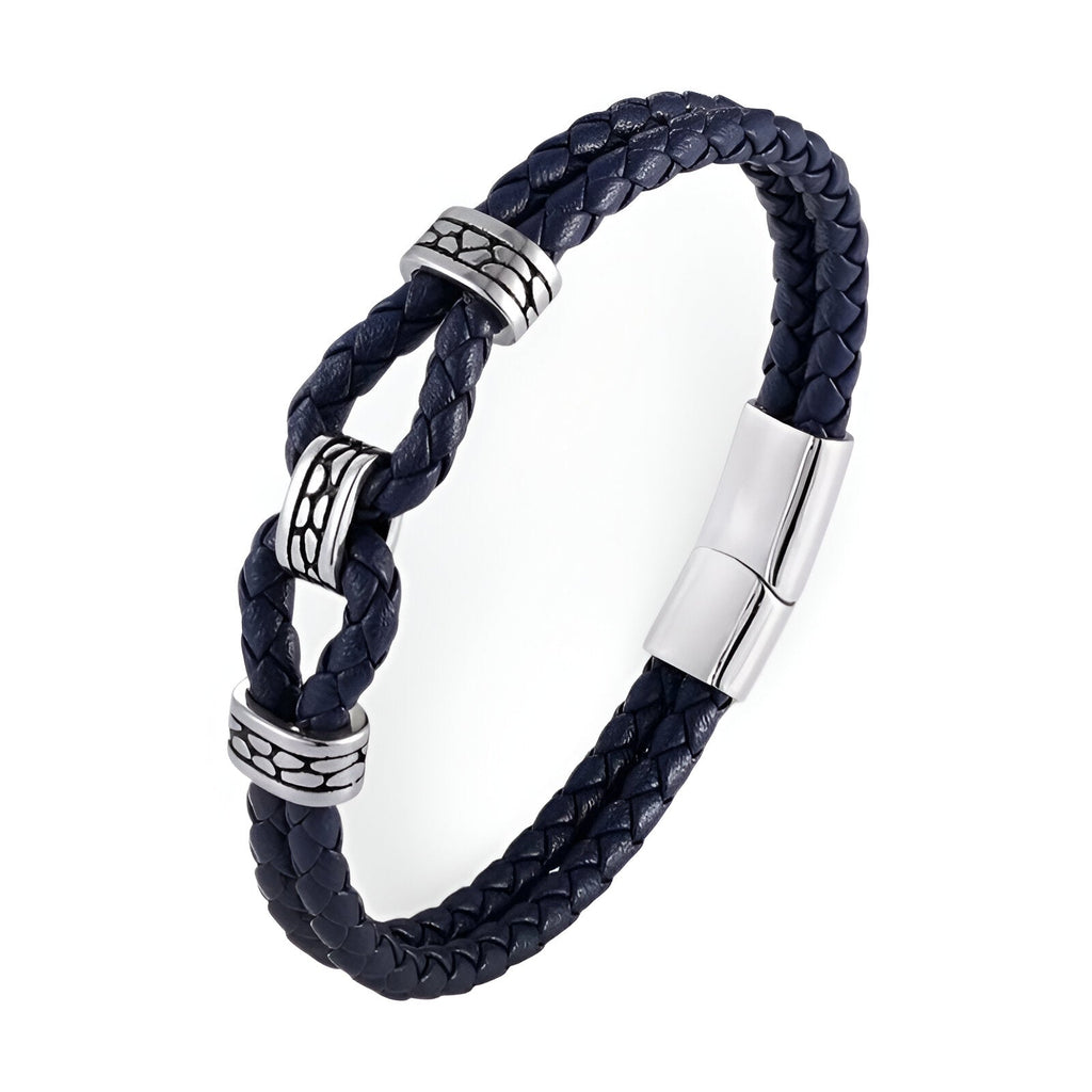 Bracelet en cuir noir tressé avec nœud et détails métalliques argentés, fermoir magnétique élégant.