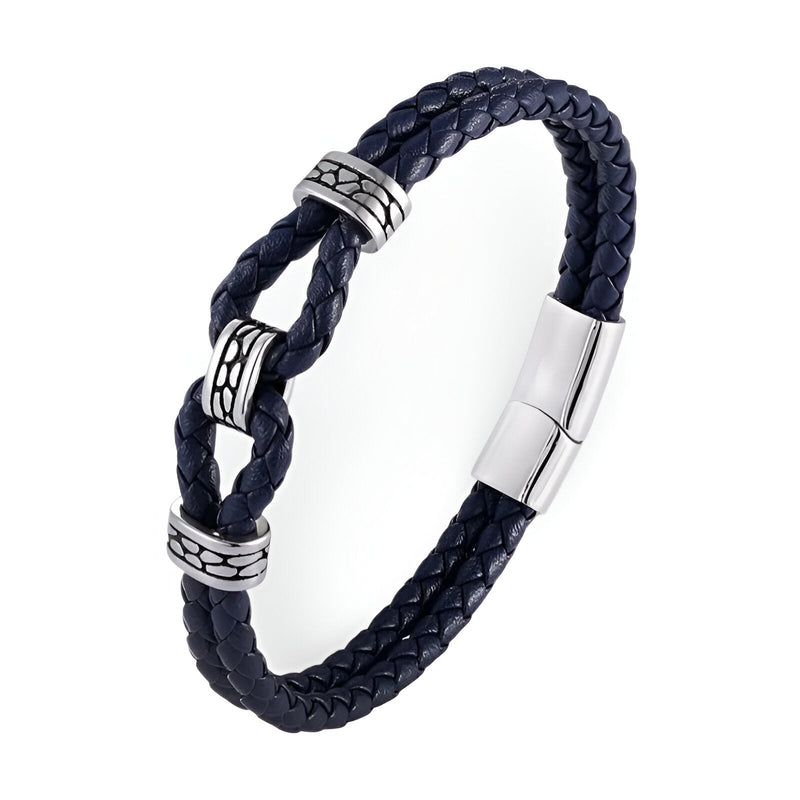Bracelet en cuir noir tressé avec nœud et détails métalliques argentés, fermoir magnétique élégant.