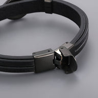 Bracelet noir en cuir doublé avec motif infini en acier inoxydable noir mat.