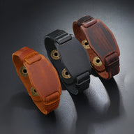 Bracelet large en cuir avec boutons-pression, disponible en noir, café et marron, style masculin robuste.