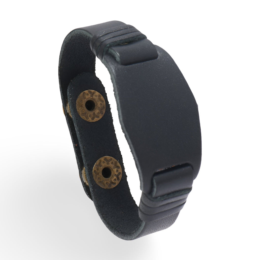 Bracelet large en cuir noir avec fermoir à boutons-pression et design minimaliste.