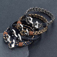 Ensemble de bracelets marins en cuir tressé avec ancre en acier inoxydable, styles variés et couleurs naturelles.