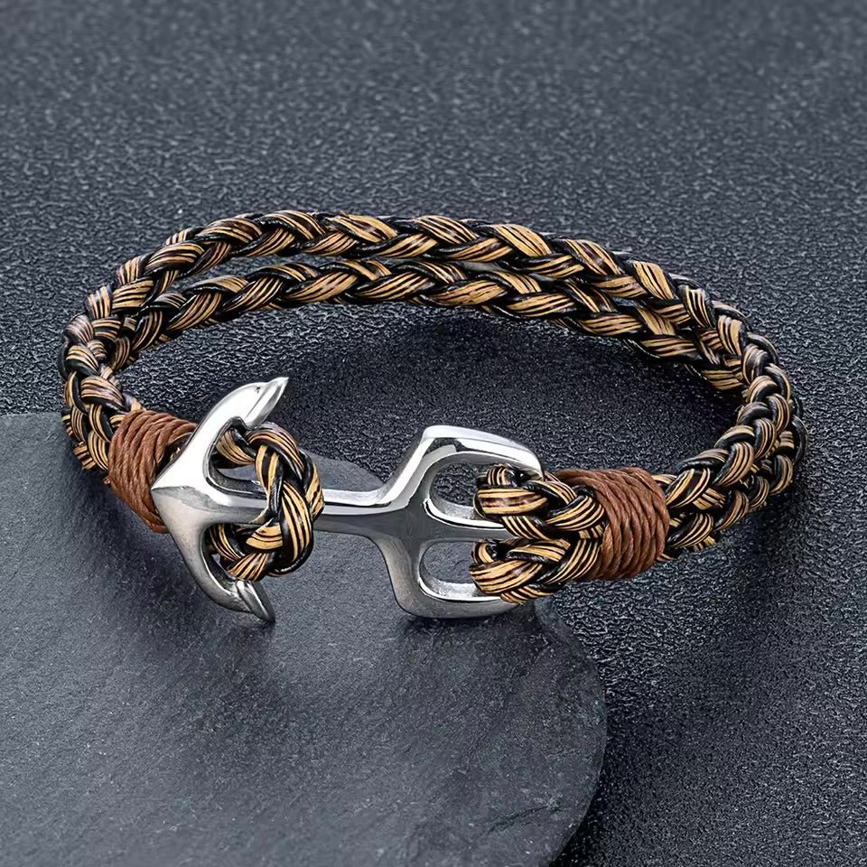 Bracelet en cuir tressé noir et marron avec ancre en acier inoxydable argenté, modèle marin.