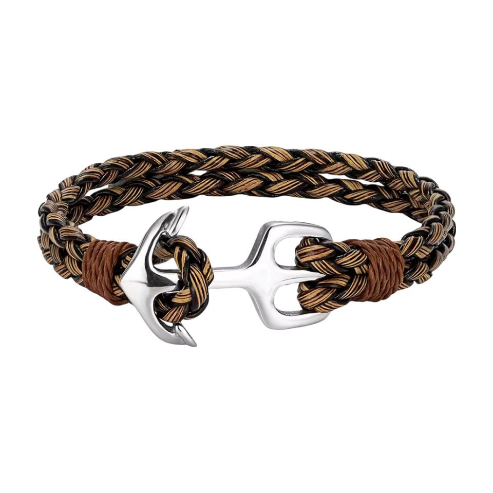 Bracelet en cuir tressé marron et beige avec ancre argentée en acier inoxydable, style marin.