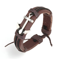 Bracelet en cuir marron avec ancre marine en métal argenté, style mixte avec cordons ajustables.
