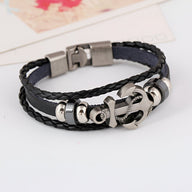 Bracelet homme multi-rangs en cuir noir avec ancre marine et fermoir magnétique argenté.