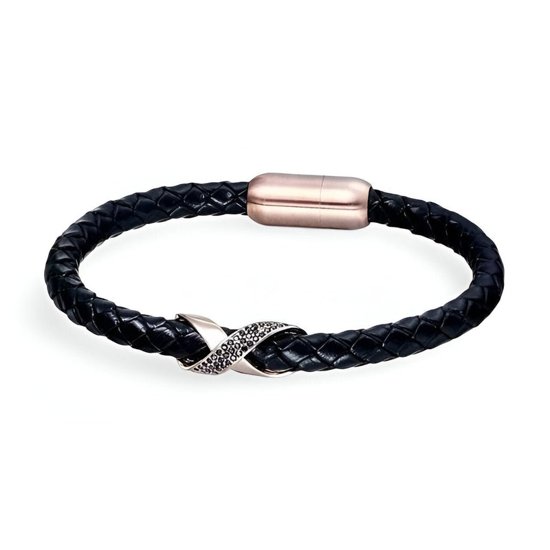 Bracelet en cuir noir tressé avec nœud central en acier or rosé et fermoir magnétique assorti.