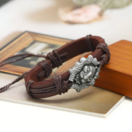 Bracelet en cuir marron avec tête de lion en métal argenté, style masculin robuste.