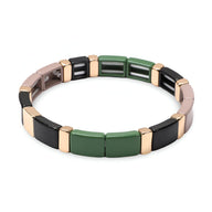 Bracelet en émail pour femme avec maillons verts, noirs et métallisés dorés style Calypso.