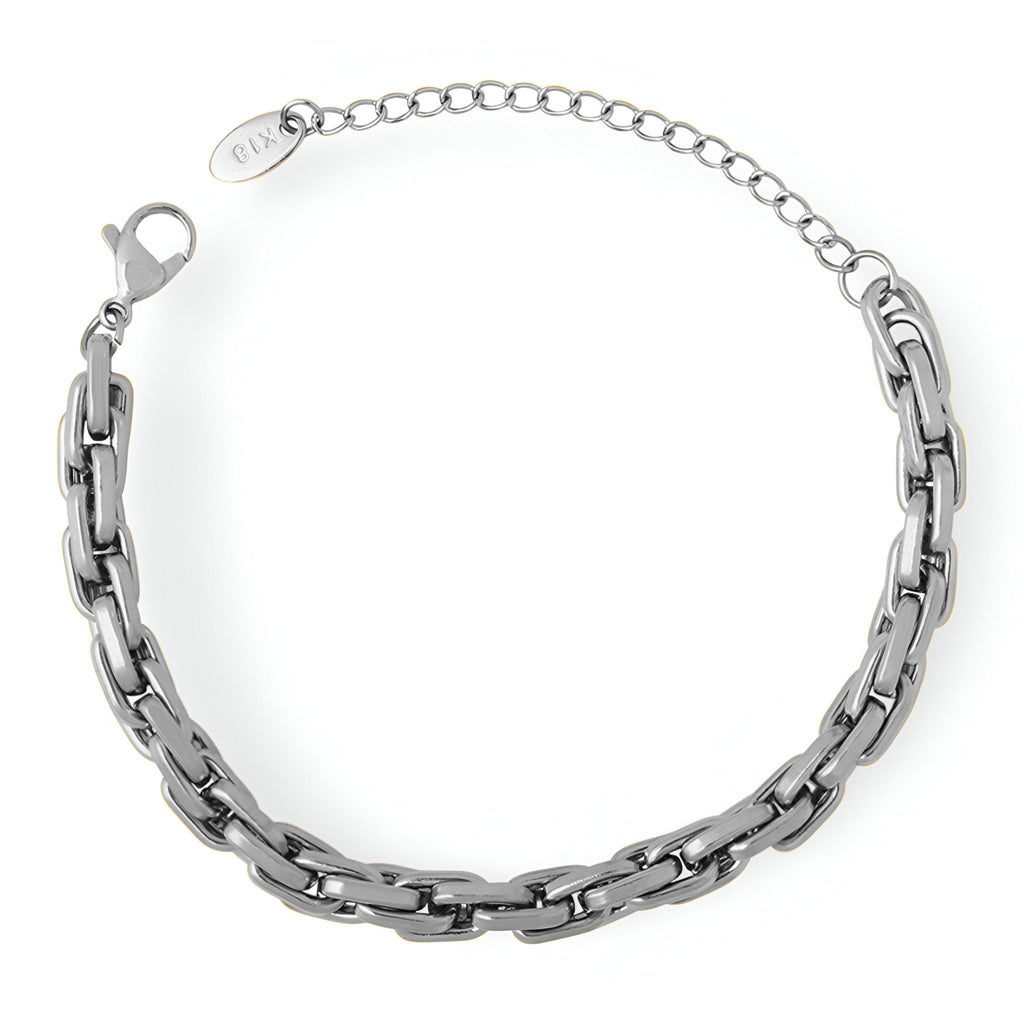 Bracelet en maille épaisse en titane argenté avec fermoir à mousqueton et chaîne ajustable.