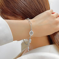 Bracelet argenté en maille épaisse avec pendentif arbre de vie en acier inoxydable.