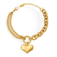 Bracelet en maille gourmette doré 18 carats avec pendentif cœur lisse et fermoir mousqueton.