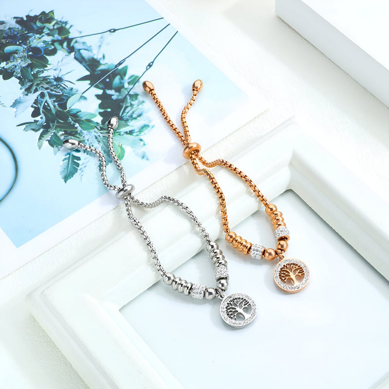 Bracelet en maille réglable en or rosé avec pendentif arbre de vie en zircon synthétique et bracelet similaire en argent.