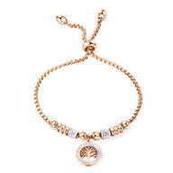 Bracelet or rosé en maille avec pendentif arbre de vie en zircon synthétique brillant.