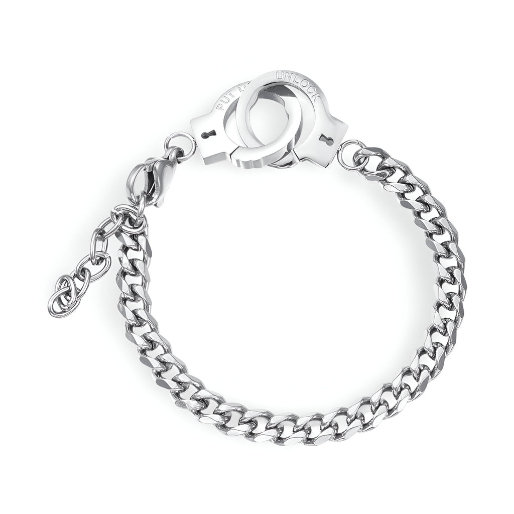 Bracelet femme en acier inoxydable argenté avec maille épaisse et menottes en pendentif.
