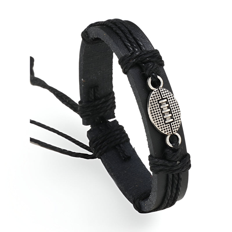 Bracelet noir en microfibre avec cordons tressés et médaillon rond texturé en métal.