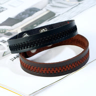 Bracelet en microfibre noir tressé pour homme avec fermeture argentée et intérieur orange marron tressé.