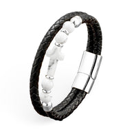 Bracelet homme microfibre noire tressée avec perles argentées et croix chrétienne en pierre, fermoir métallique brillant.
