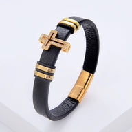 Bracelet homme microfibre noir avec croix chrétienne dorée scintillante et fermoir doré.