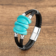 Bracelet homme en microfibre noir avec trois pierres turquoise et fermoir argenté brillant.