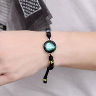 Bracelet en nylon noir avec pendentif rond signe du zodiaque lumineux bleu vert, ajustable.