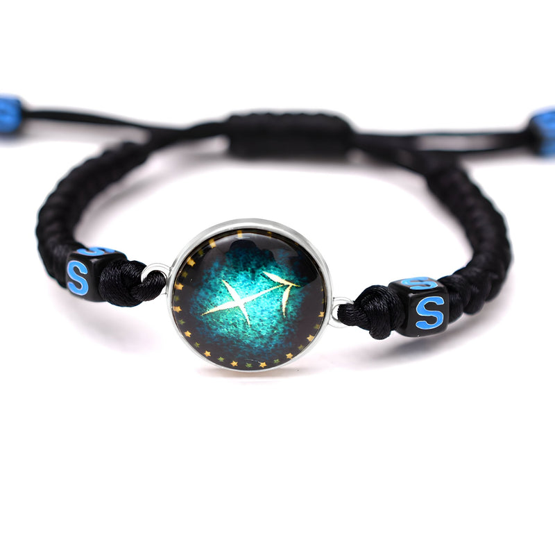 Bracelet en nylon noir tressé avec pendentif rond bleu vert signe astrologique Sagittaire et perles bleues à lettres S.