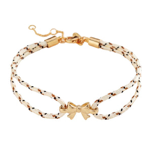Pulsera de nailon trenzado con charm de lazo dorado, accesorio femenino ajustable y refinado, ideal para un look chic y espontáneo, modelo Rubane