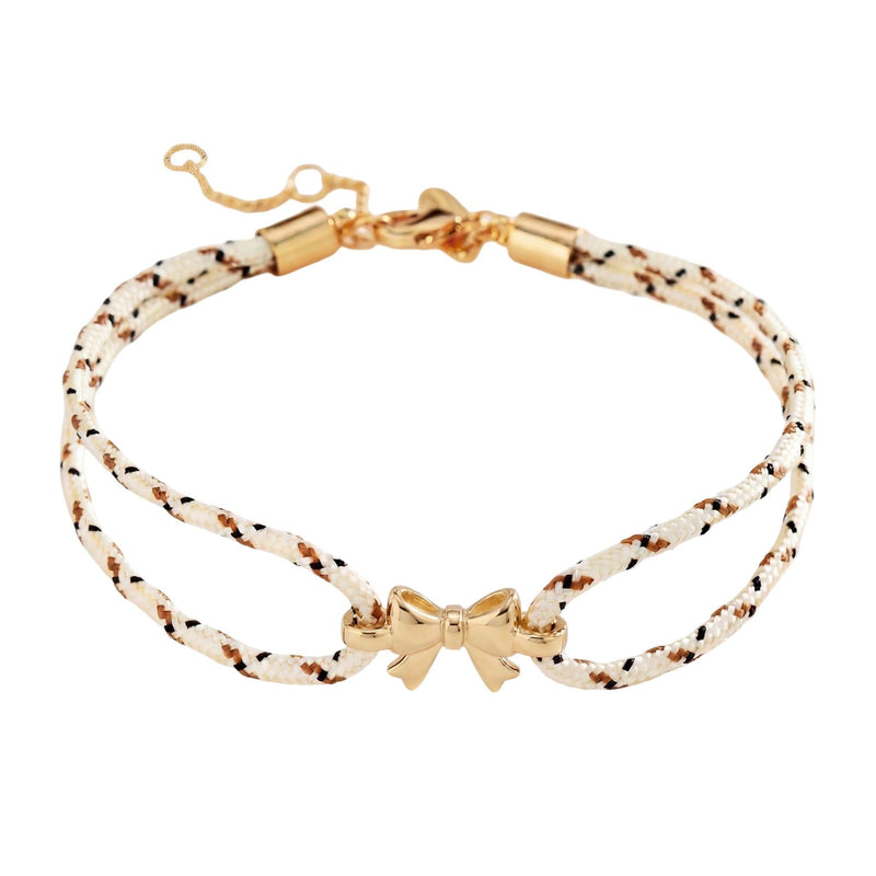 Pulsera de nailon trenzado con charm de lazo dorado, accesorio femenino ajustable y refinado, ideal para un look chic y espontáneo, modelo Rubane