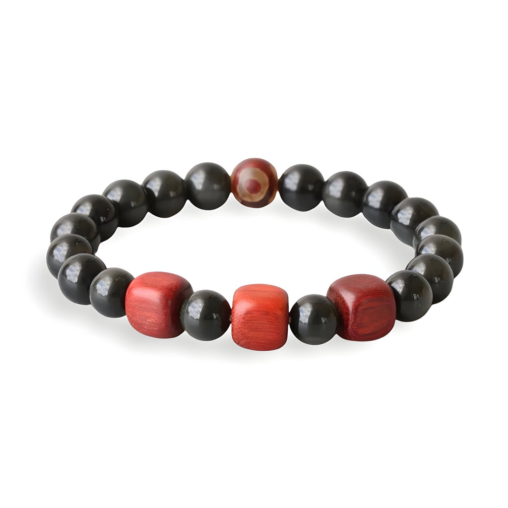 Bracelet mixte en perles d'obsidienne noire avec trois perles rouges en bois au centre.