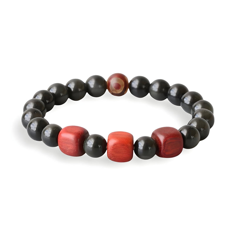 Bracelet mixte en perles d'obsidienne noire avec trois perles rouges en bois au centre.