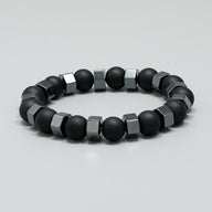 Bracelet pour homme en perles noires d'obsidienne et cubes en verre gris mat.