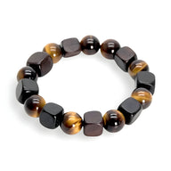 Bracelet mixte avec perles rondes en œil de tigre marron et cubes en bois d’ébène noir mat.