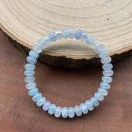 Bracelet en opaline, pierre bleue translucide, perles rondes élastique scintillantes, modèle Aloka - La Boutique du Bracelet
